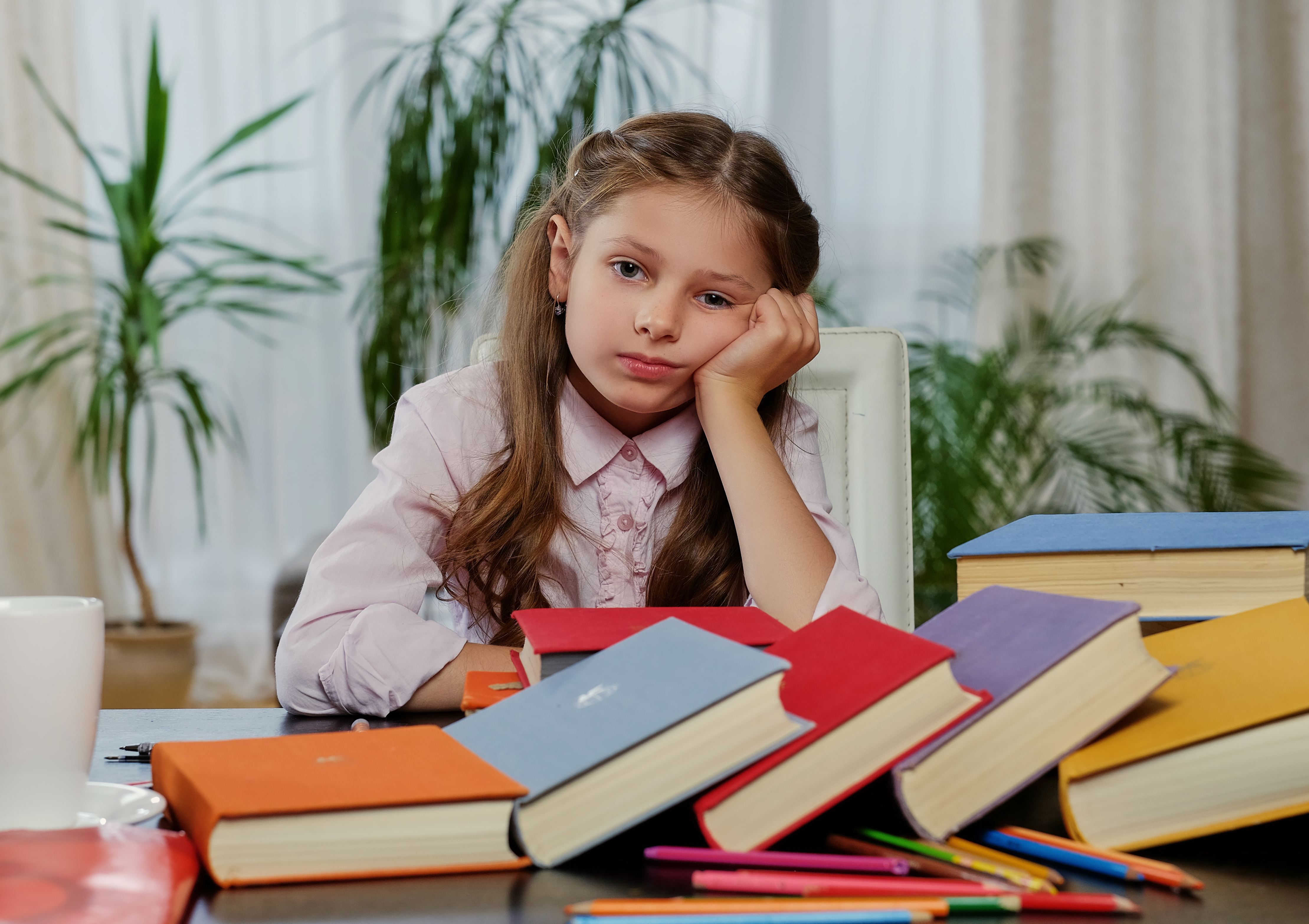 tired-little-girl-after-studying-reading-lot-books.jpg